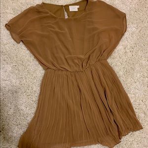 Dress. Sheer material. Pleated skirt.